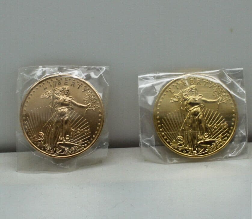 https://coinscarats.com/_next/image?url=%2Fassets%2Fimg%2Ffake-gold-eagles.jpeg&w=1080&q=75